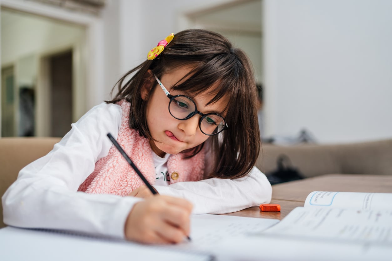 child with dyslexia practicing homeworg